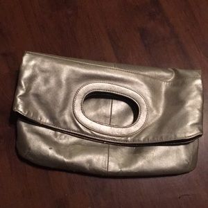 Gold fold over clutch bag